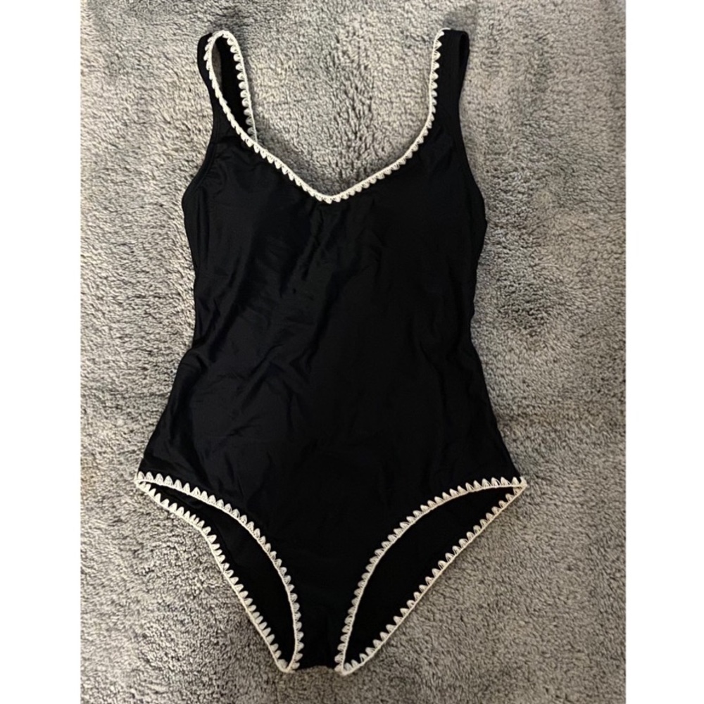 Black and white one piece bathing suit.